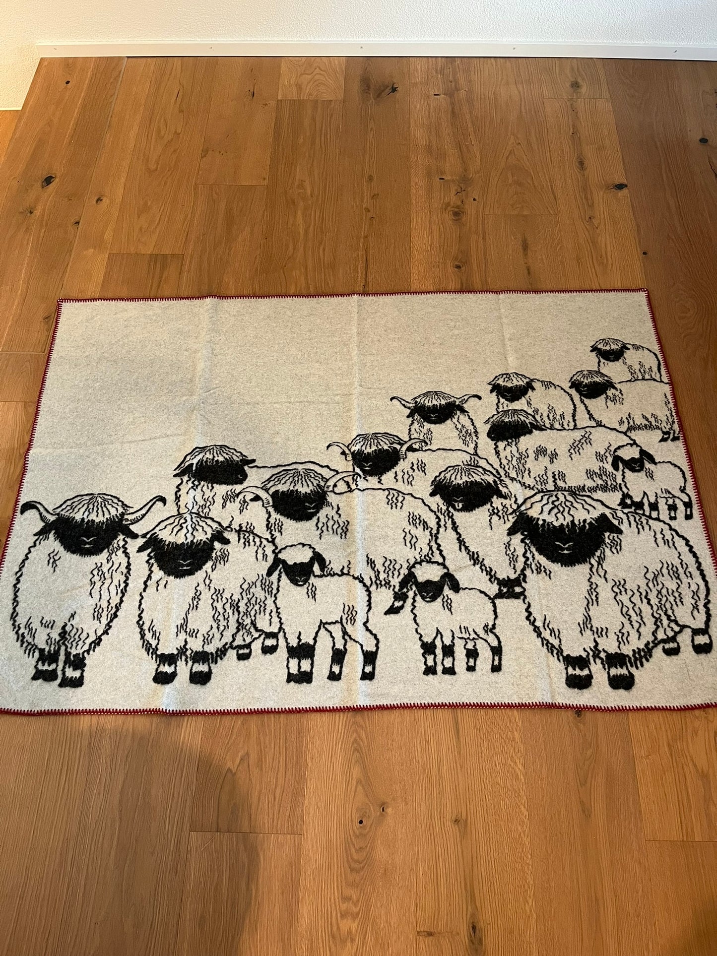 Valais Blacknose Sheep Blanket – Soft Merino Souvenir from Zermatt, red border