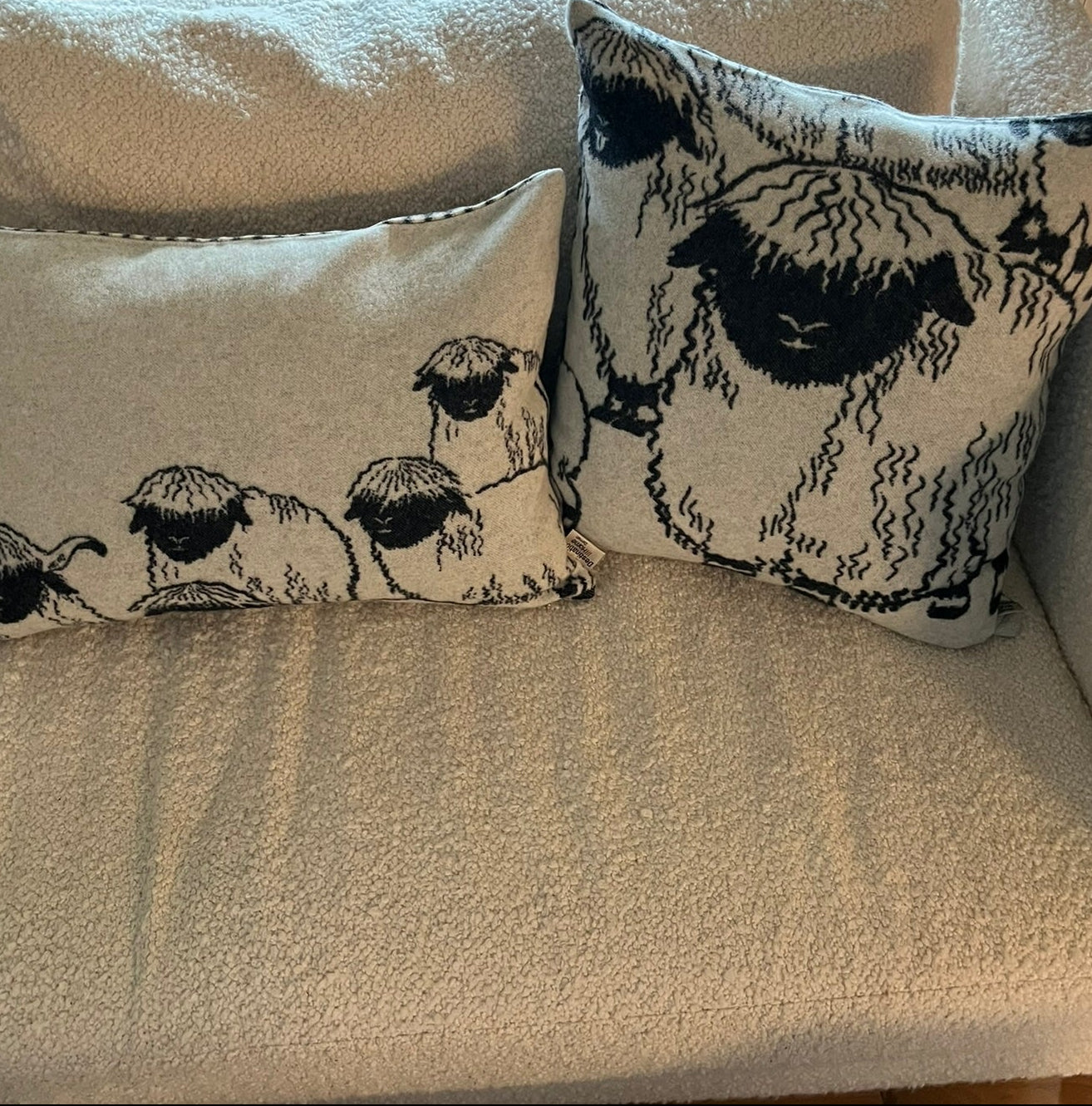 Blacknose sheep wool cushion cover, group of sheep